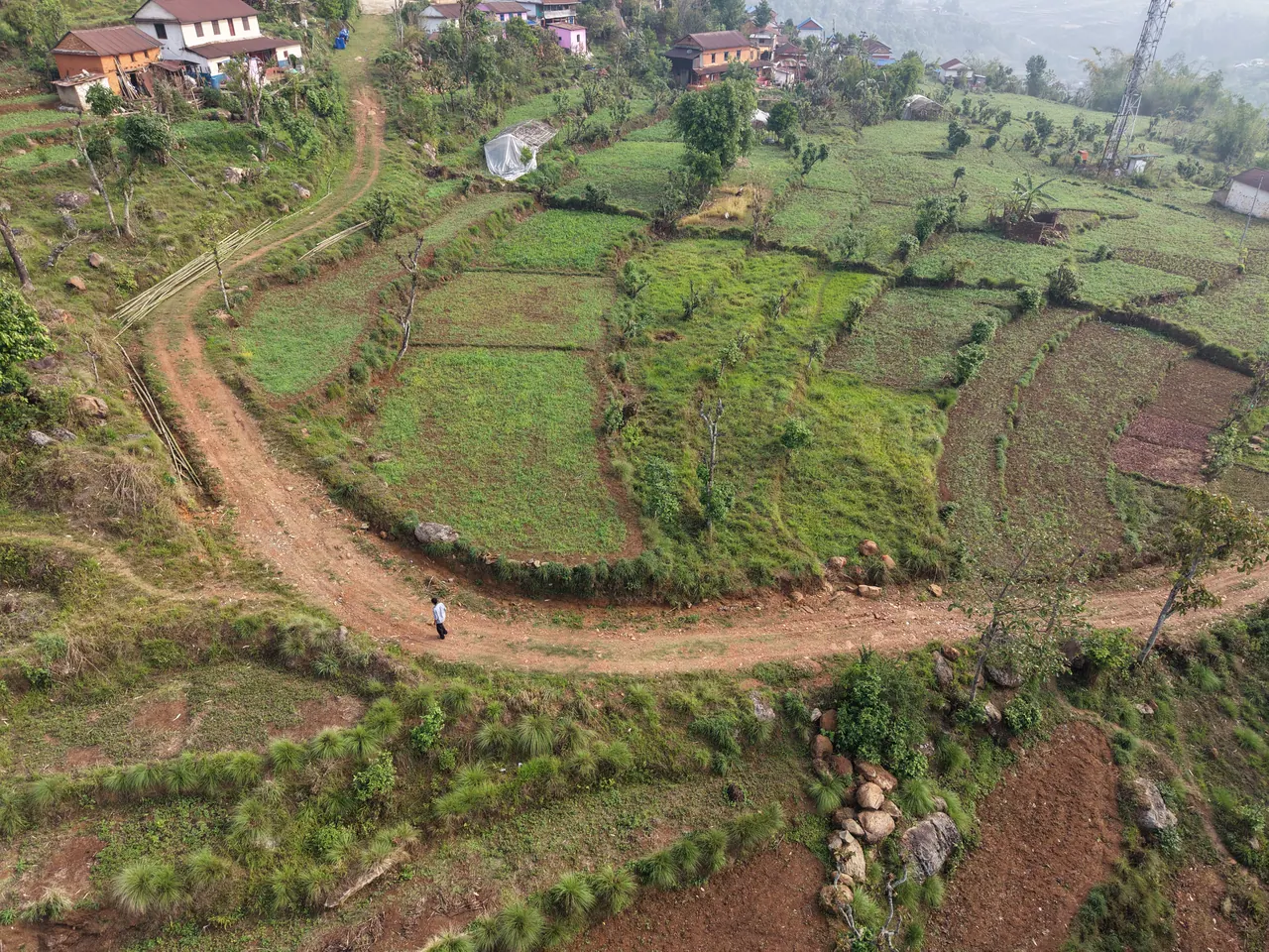Drone view of the farm road and terraced fields in Bahatari village